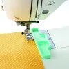 Varrás vezető, Varrógép pozicionáló eszköz
