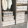 Átlátszó 3D tárolózsák ruhákhoz, játékokhoz és egyéb tárgyakhoz, porálló kialakítással és nagy kapacitással - Polikróm